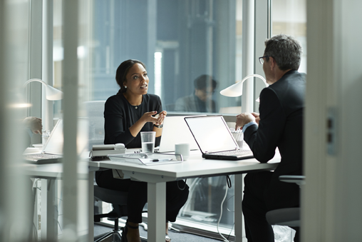 women networking around a computer