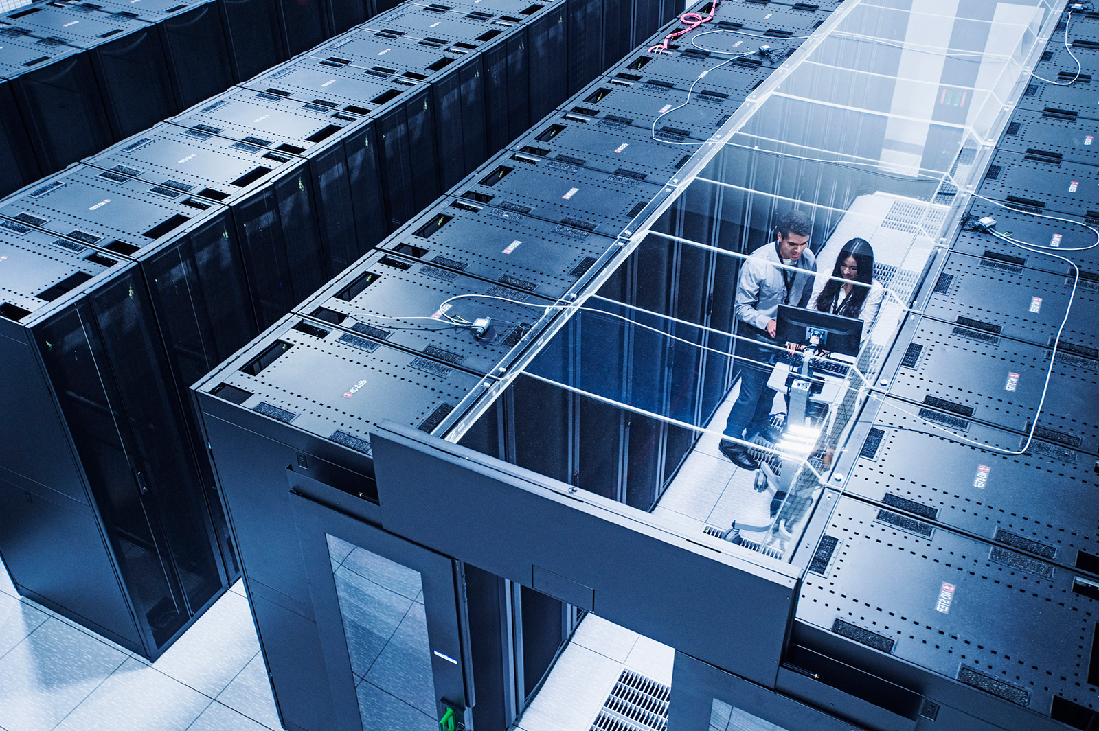 employees amongst server racks
