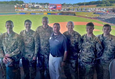 ASRC Federal Employee, Clay Davis with US Army Customers at Huntsville Trash Panda Employee Engagement Event