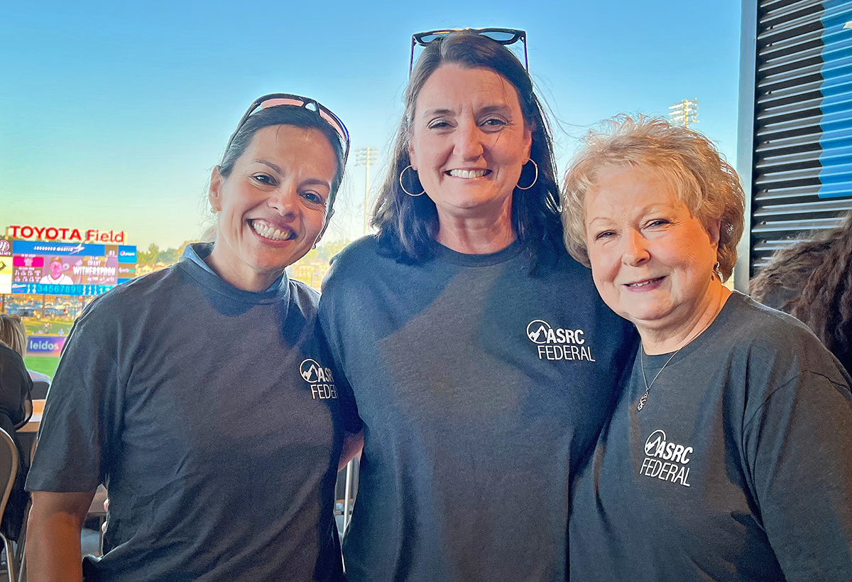 ASRC Federal employees at a Rocket City Trash Panda baseball game and employee outing.